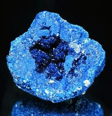 Close-up comparison of deep blue Nepalese kyanite stones showing velvety texture and light absorption qualities