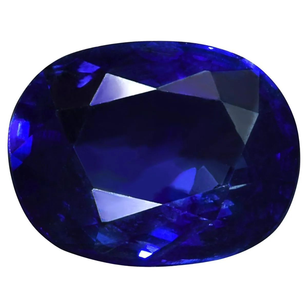 A collection of various kyanite pieces including raw crystals and tumbled stones arranged on a wooden surface