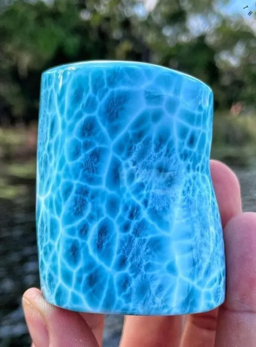 Hand testing wire wrapped kyanite pendant for secure hold